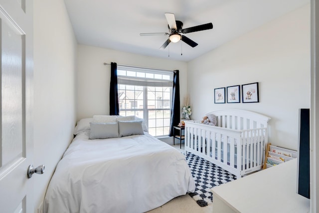 carpeted bedroom with ceiling fan