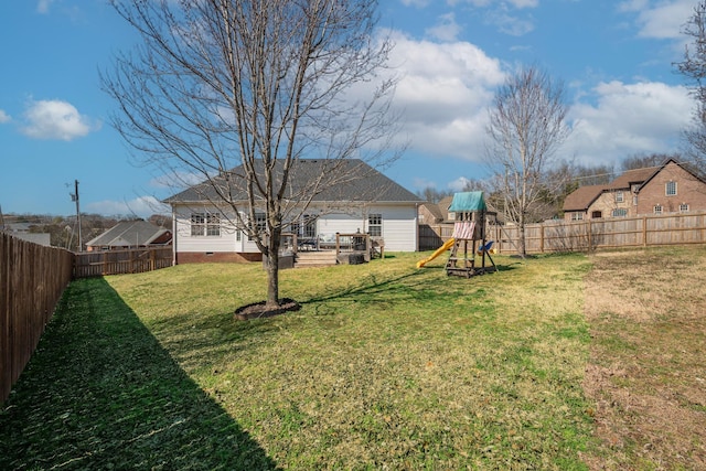 view of yard featuring a fenced backyard and a playground