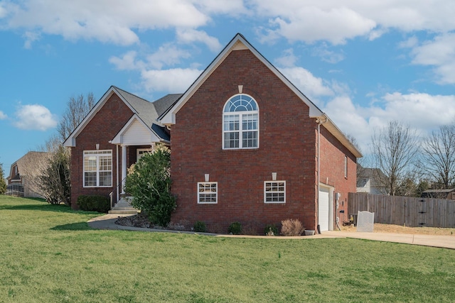 traditional home featuring a garage, brick siding, concrete driveway, and fence