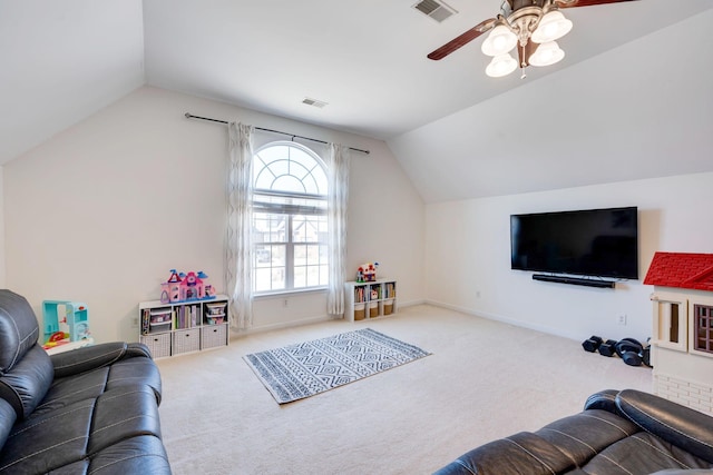 living area featuring visible vents, baseboards, carpet flooring, and vaulted ceiling