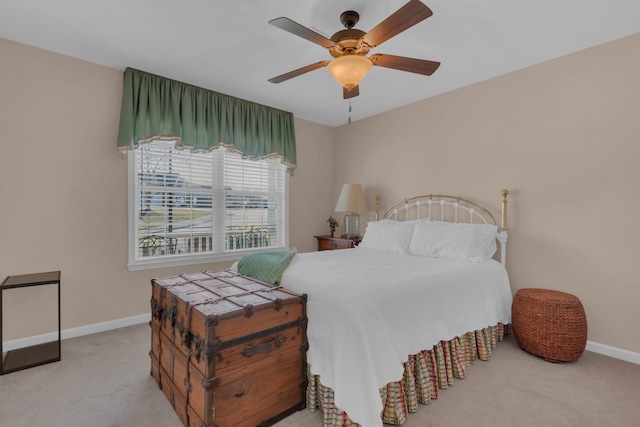 bedroom with a ceiling fan, carpet, and baseboards