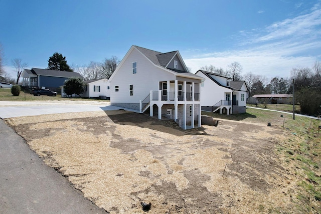 view of front of property featuring stairs