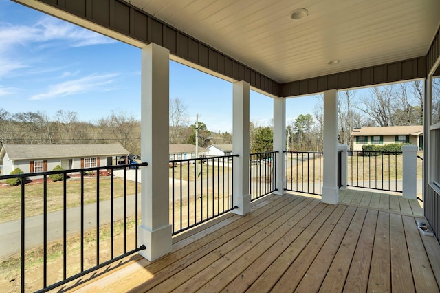 wooden terrace featuring a residential view