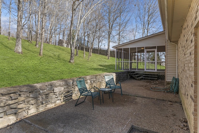 view of patio / terrace featuring a sunroom