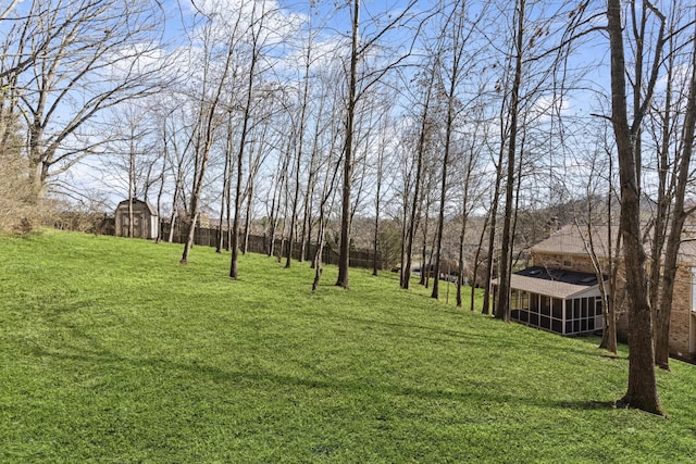 view of yard with an outdoor structure and a shed