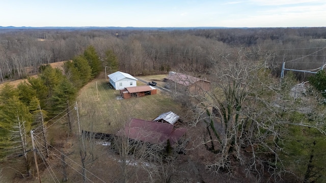 bird's eye view featuring a view of trees and a rural view