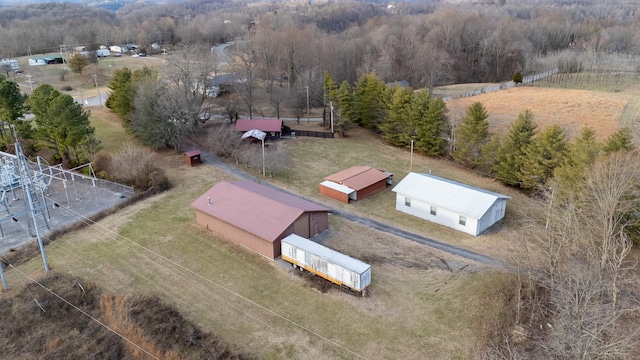 bird's eye view featuring a rural view and a wooded view