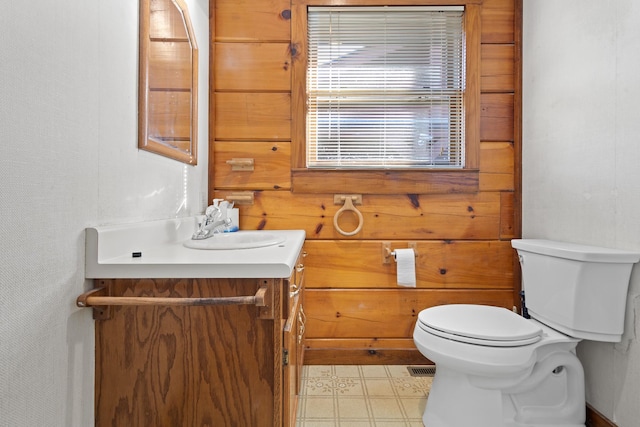 bathroom featuring tile patterned floors, toilet, and vanity