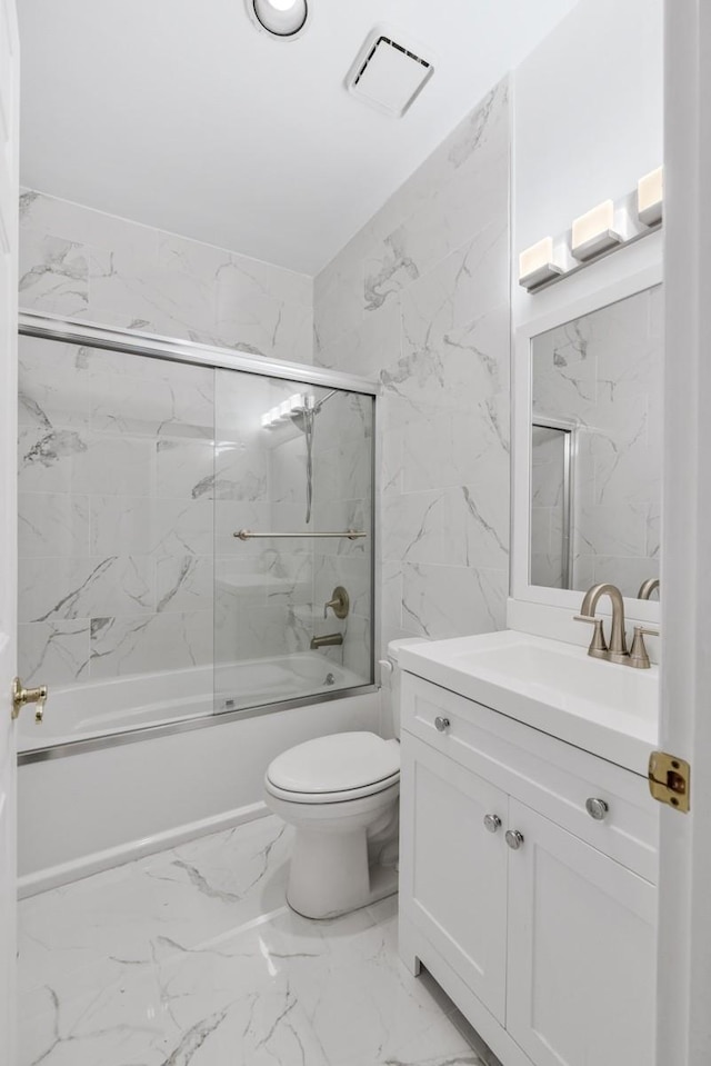 bathroom featuring visible vents, bath / shower combo with glass door, toilet, marble finish floor, and vanity