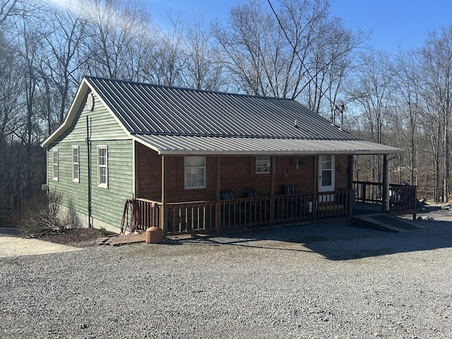 view of front of house with a porch and metal roof