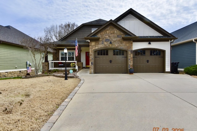 craftsman-style house featuring stone siding, covered porch, board and batten siding, concrete driveway, and a garage