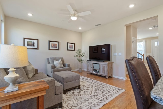 living area with recessed lighting, light wood-style floors, visible vents, and baseboards