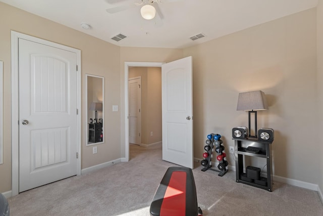 interior space with visible vents, ceiling fan, baseboards, and carpet