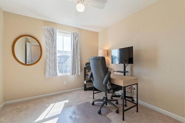 home office featuring a ceiling fan, carpet, and baseboards