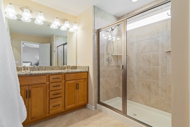 full bathroom with tile patterned flooring, ensuite bath, a stall shower, and a sink