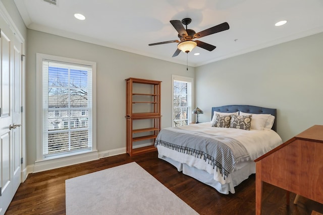 bedroom featuring recessed lighting, ornamental molding, baseboards, and wood finished floors