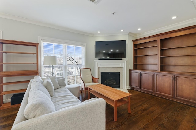 living area with crown molding, dark wood-style floors, recessed lighting, and a fireplace