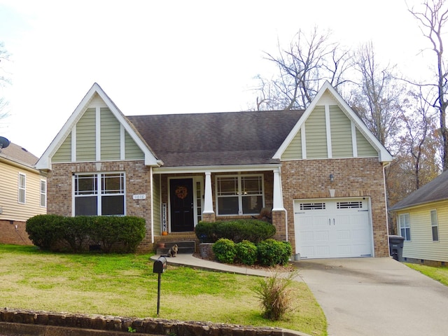 view of front of home with a garage, driveway, brick siding, and a front yard