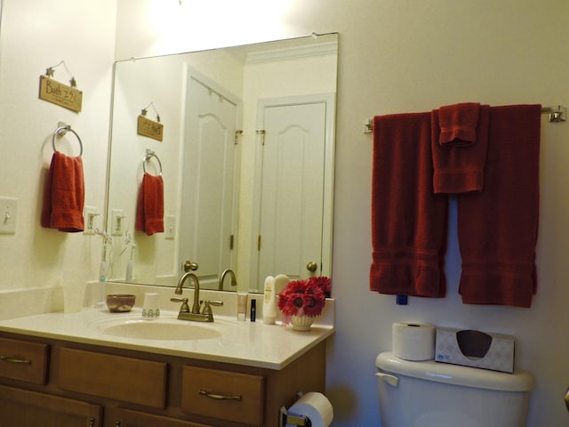 bathroom with toilet and vanity