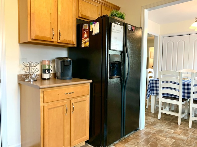 1016 Sunset Dr, Clarksville, TN 37040 - kitchen with black refrigerator with ice dispenser and light countertops