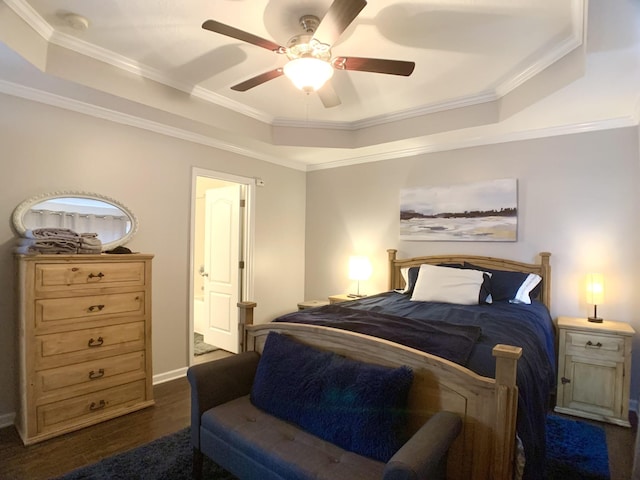 1016 Sunset Dr, Clarksville, TN 37040 - bedroom with ornamental molding, a raised ceiling, and dark wood-style flooring