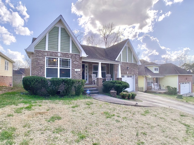 1016 Sunset Dr, Clarksville, TN 37040 - view of front of house featuring brick siding, concrete driveway, a front yard, and a garage
