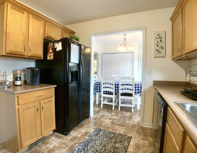 1016 Sunset Dr, Clarksville, TN 37040 - kitchen with a chandelier, dishwasher, light countertops, black refrigerator with ice dispenser, and a sink