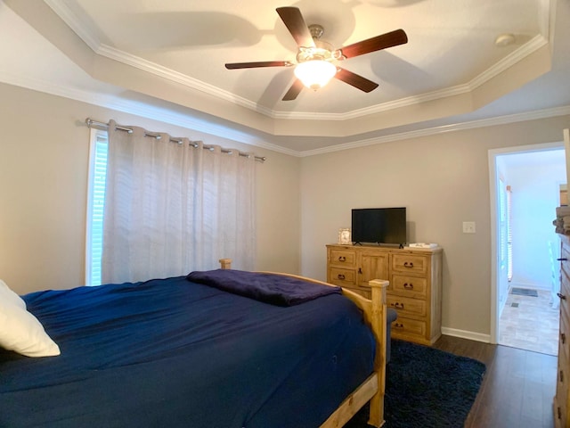 1016 Sunset Dr, Clarksville, TN 37040 - bedroom with a tray ceiling, wood finished floors, and a ceiling fan