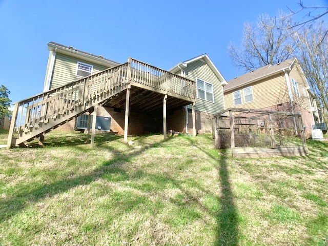 1016 Sunset Dr, Clarksville, TN 37040 - back of property featuring stairway, a wooden deck, a lawn, cooling unit, and a garden
