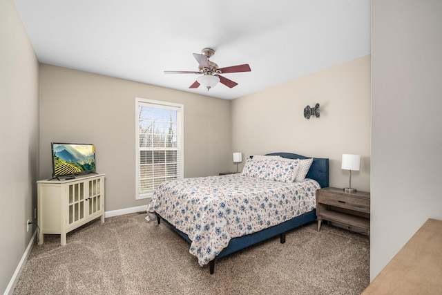 carpeted bedroom with a ceiling fan and baseboards