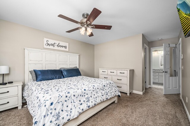 bedroom featuring connected bathroom, baseboards, ceiling fan, and carpet flooring