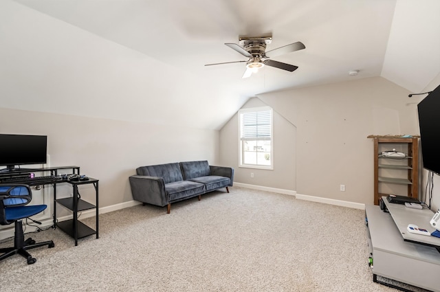 carpeted office with baseboards, lofted ceiling, and a ceiling fan