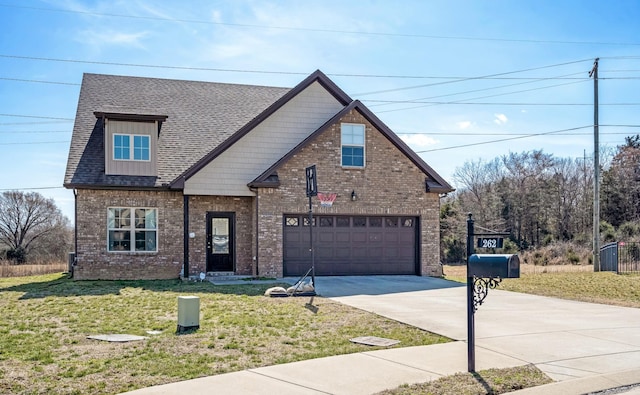 traditional-style home featuring driveway, roof with shingles, a front lawn, a garage, and brick siding