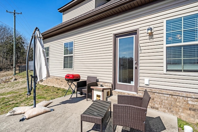 view of patio featuring fence