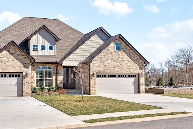 view of front of home featuring brick siding, an attached garage, and driveway