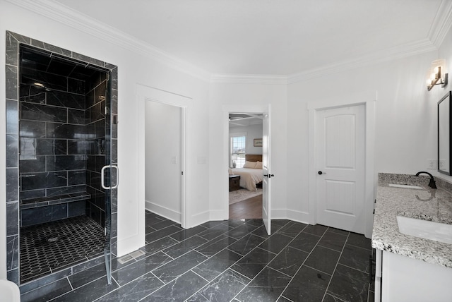 ensuite bathroom featuring ensuite bath, double vanity, a stall shower, a sink, and crown molding