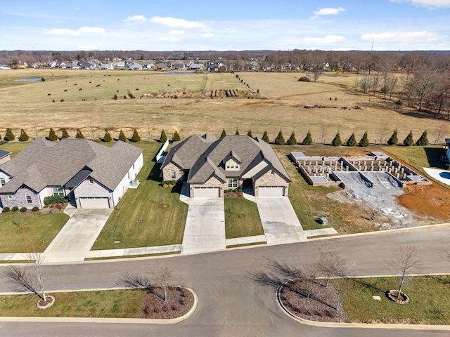 bird's eye view with a rural view and a residential view