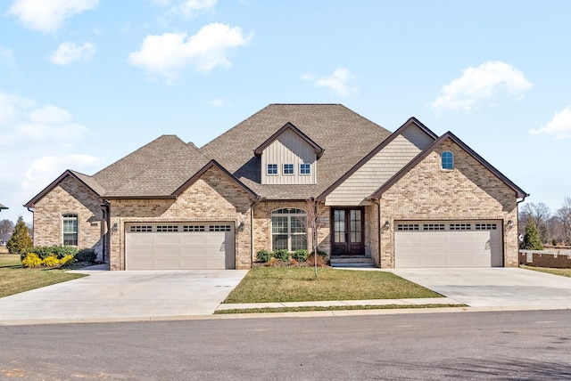 view of front of house with a front lawn, brick siding, driveway, and roof with shingles