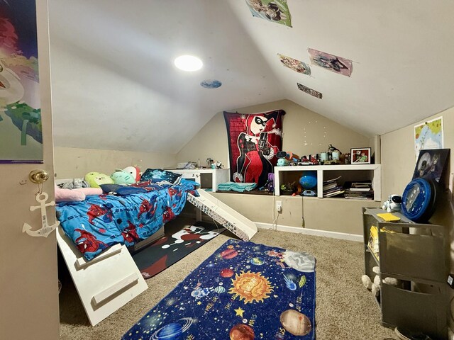 bedroom with vaulted ceiling and carpet