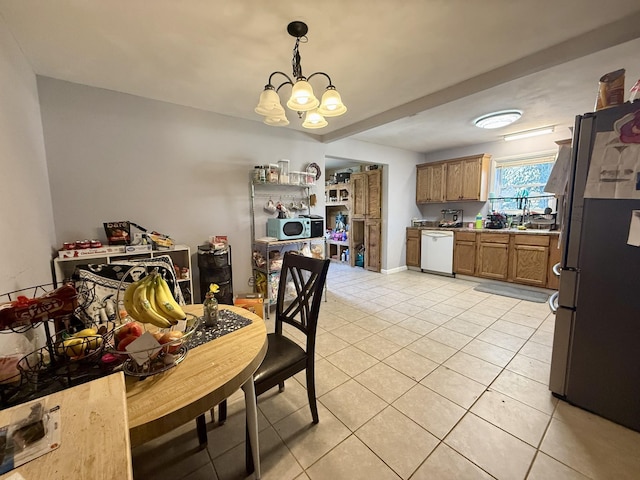 dining space featuring light tile patterned flooring and a notable chandelier