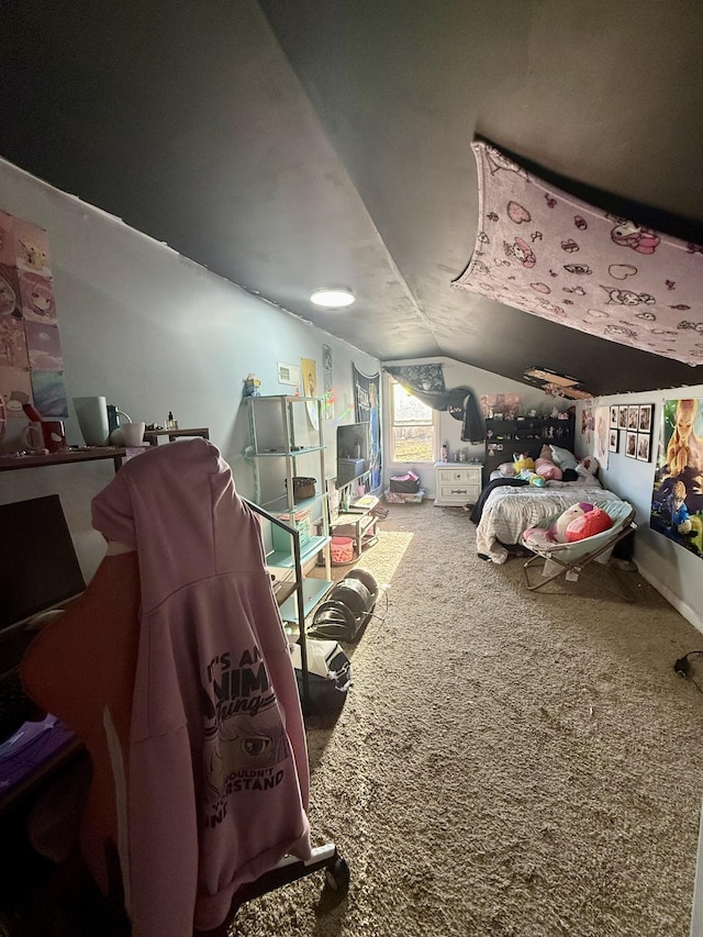 bedroom featuring carpet flooring and vaulted ceiling