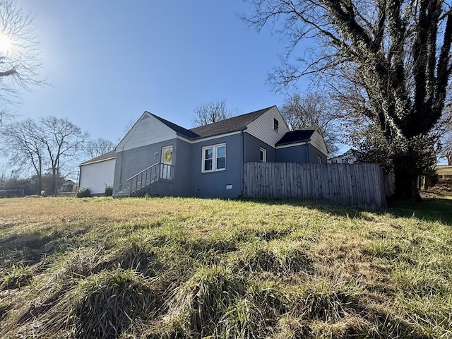 view of home's exterior featuring fence and crawl space