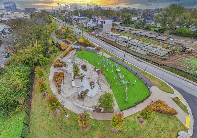 aerial view at dusk featuring a residential view