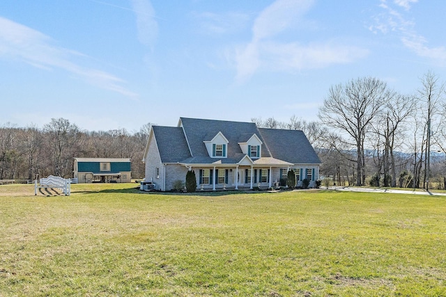 view of front of home featuring a front lawn and cooling unit