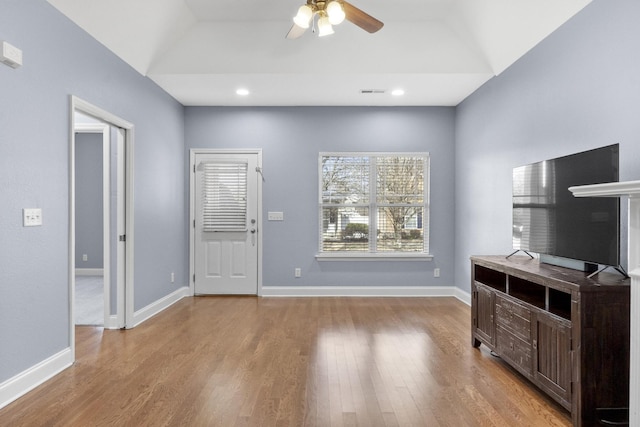 foyer with a ceiling fan, wood finished floors, baseboards, lofted ceiling, and recessed lighting