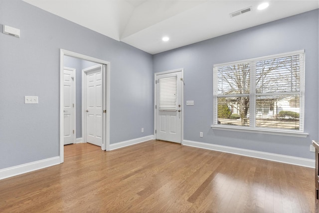 foyer entrance with recessed lighting, wood finished floors, visible vents, and baseboards