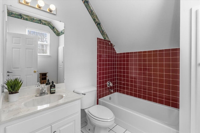 bathroom featuring shower / washtub combination, toilet, vanity, and vaulted ceiling