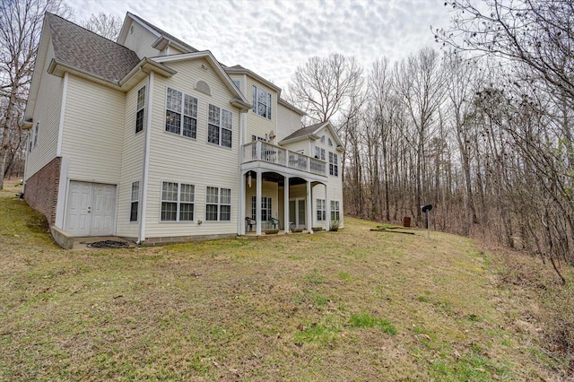 rear view of house featuring a deck and a yard