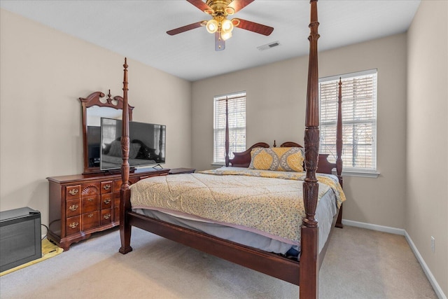 bedroom with a ceiling fan, baseboards, visible vents, and carpet floors