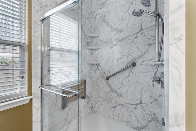 full bathroom featuring a marble finish shower